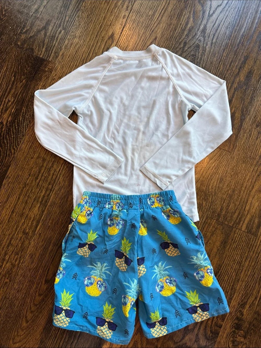 Pineapple swim trunks and rashguard